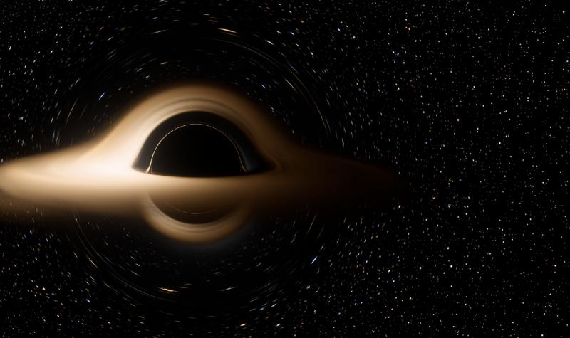 A black hole's shadow framed by the bent light of its glowing disk